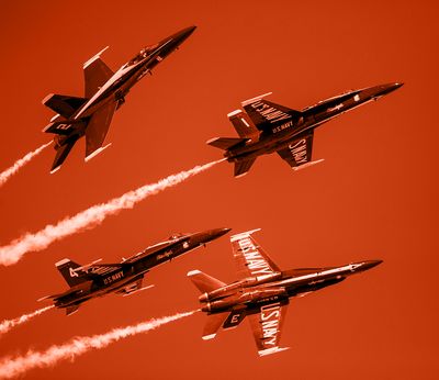 Blue Angels F-18s flying in formation.
